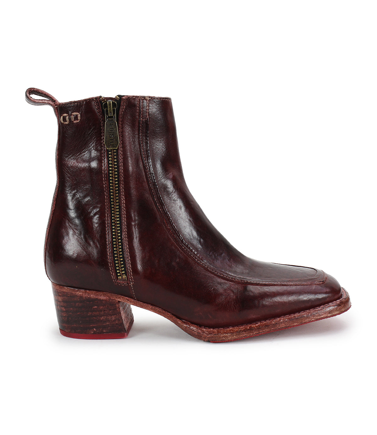 The Bed|Stü Bitsy is a single dark brown leather ankle boot featuring a side zipper, stacked heel, and pull tab at the back, photographed on a white background.