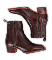 A pair of Bed|Stü Bitsy dark brown leather boots with side zippers and chunky stacked heels, displayed side by side on a white background.