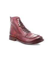 Presenting the Blimey boot by Bed|Stü: a handcrafted, single dark red full-grain leather lace-up boot featuring metal eyelets, visible stitching, and a low wooden heel, made in Italy and displayed against a plain white background.