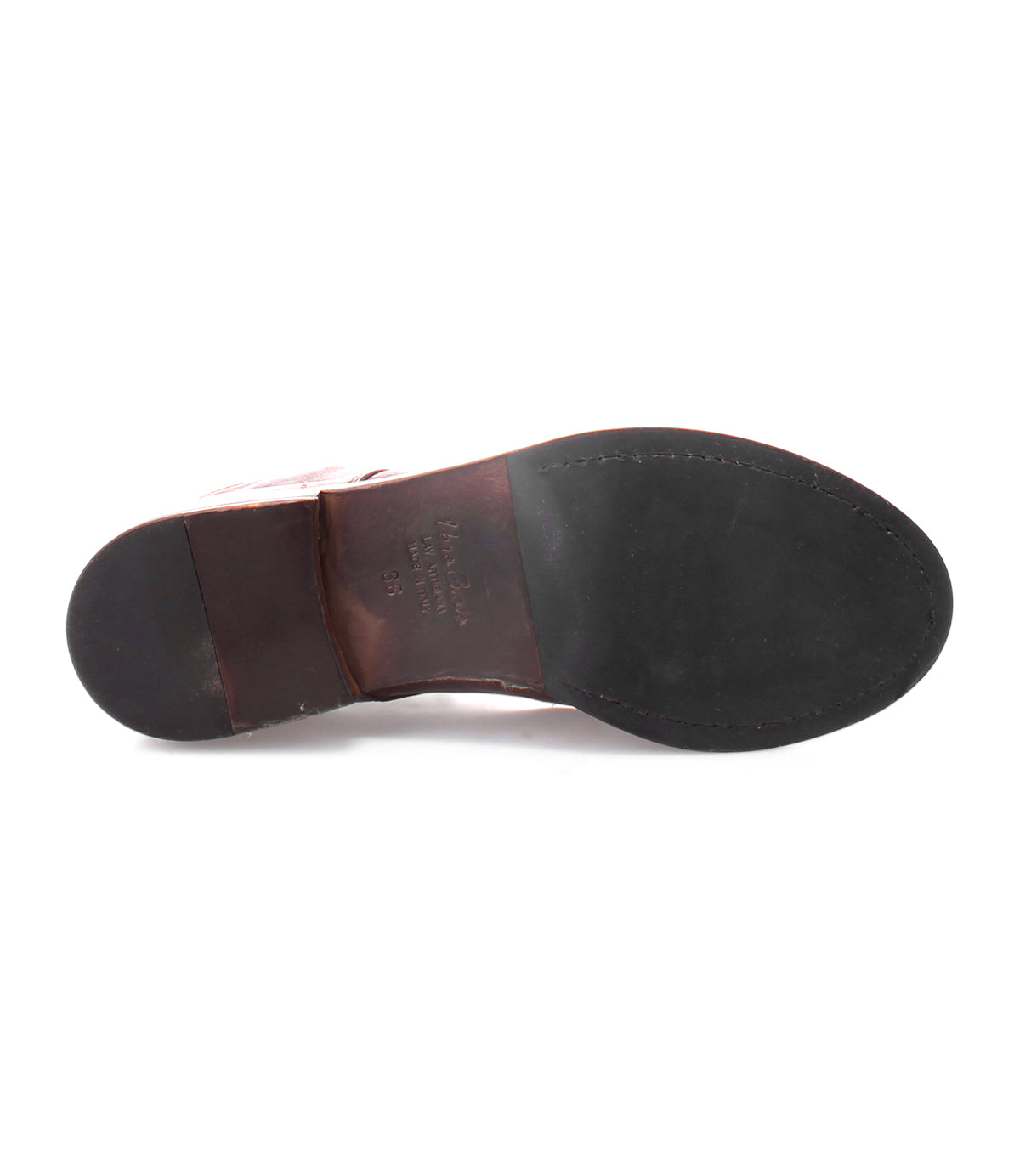 A close-up of the bottom of the Blimey dress shoe by Bed|Stü, featuring brown leather handcrafted in Italy, a black sole, and visible stitching around the toe area.