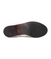A close-up of the bottom of the Blimey dress shoe by Bed|Stü, featuring brown leather handcrafted in Italy, a black sole, and visible stitching around the toe area.