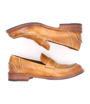 A pair of Bed|Stü Bonus tan Italian leather penny loafers displayed side by side against a white background, exuding classic style with one shoe facing up and the other facing down.