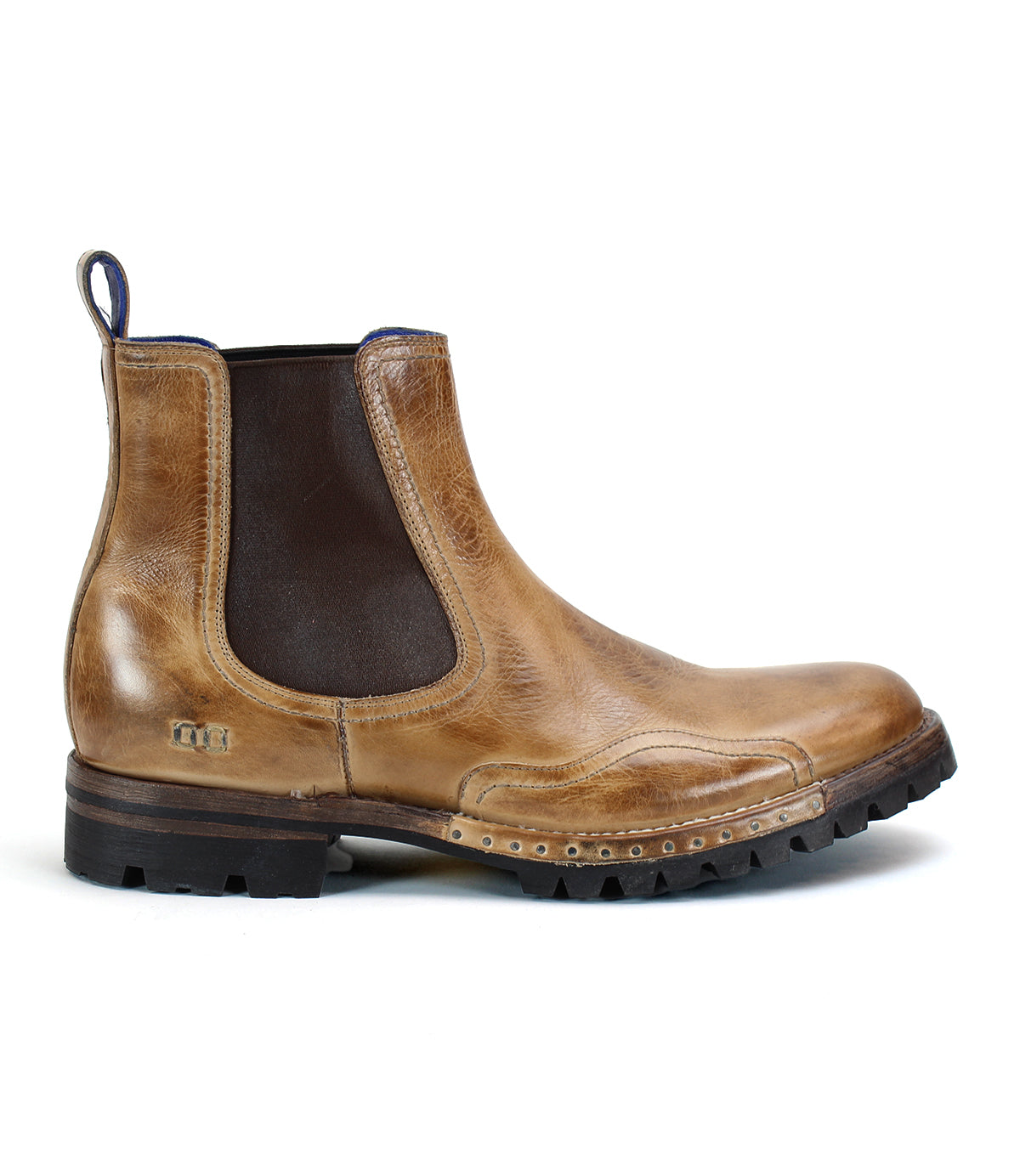 Introducing the Brady Trek by Bed|Stü—a timeless Chelsea boot crafted in tan leather, featuring a dark elastic side panel, convenient back pull tab, decorative stitching, and a textured treaded outsole for enhanced grip. Shown here in side profile view, it's the perfect versatile boot for any occasion.