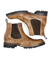 The Brady Trek by Bed|Stü is a pair of brown leather Chelsea boots featuring elastic side panels, pull tabs, and a rugged treaded outsole for superior grip—this timeless boot is displayed on a white background.
