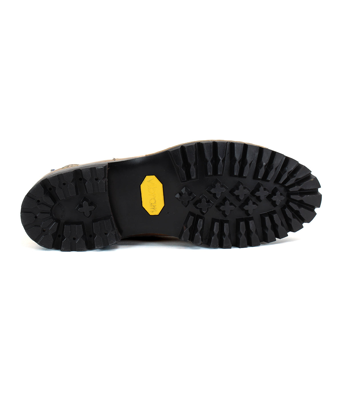 Brady Trek by Bed|Stü features a black rubber treaded outsole with deep grooves and a signature yellow logo at the center, showcased here against a white background—an essential detail of any timeless boot.