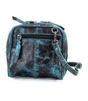 Introducing the Capture by Bed|Stü—a compact, square-shaped black leather crossbody bag featuring a striking blue marbled pattern. Designed with a convenient front zipper pocket and an adjustable shoulder strap, this stylish handbag offers both practicality and flair for everyday use.