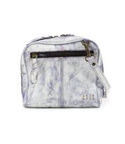 Meet Capture by Bed|Stü—a small, light purple-white textured leather crossbody bag featuring a front zipper pocket, spacious main compartment, and an adjustable shoulder strap. This compact handbag is perfect for carrying your essentials in style.
