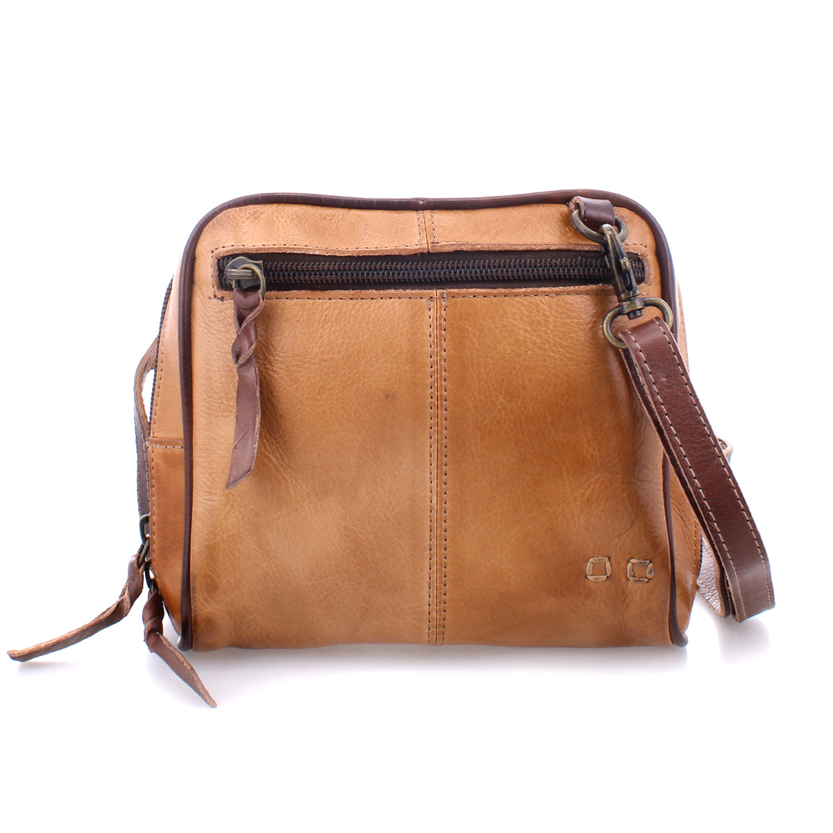 The Bed|Stü Capture is a brown leather crossbody bag featuring a front zipper pocket, detachable strap, and visible stitching, shown here as a compact handbag against a white background.