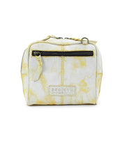 Small, rectangular marbled yellow and white handcrafted leather crossbody bag called "Capture" by Bed|Stü, featuring a front zipper pocket and the Bed|Stü label on the front.