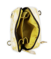The Bed|Stü Capture purse is a small, handcrafted yellow accessory that is open to reveal its empty interior, featuring two compartments and a yellow fabric lining.