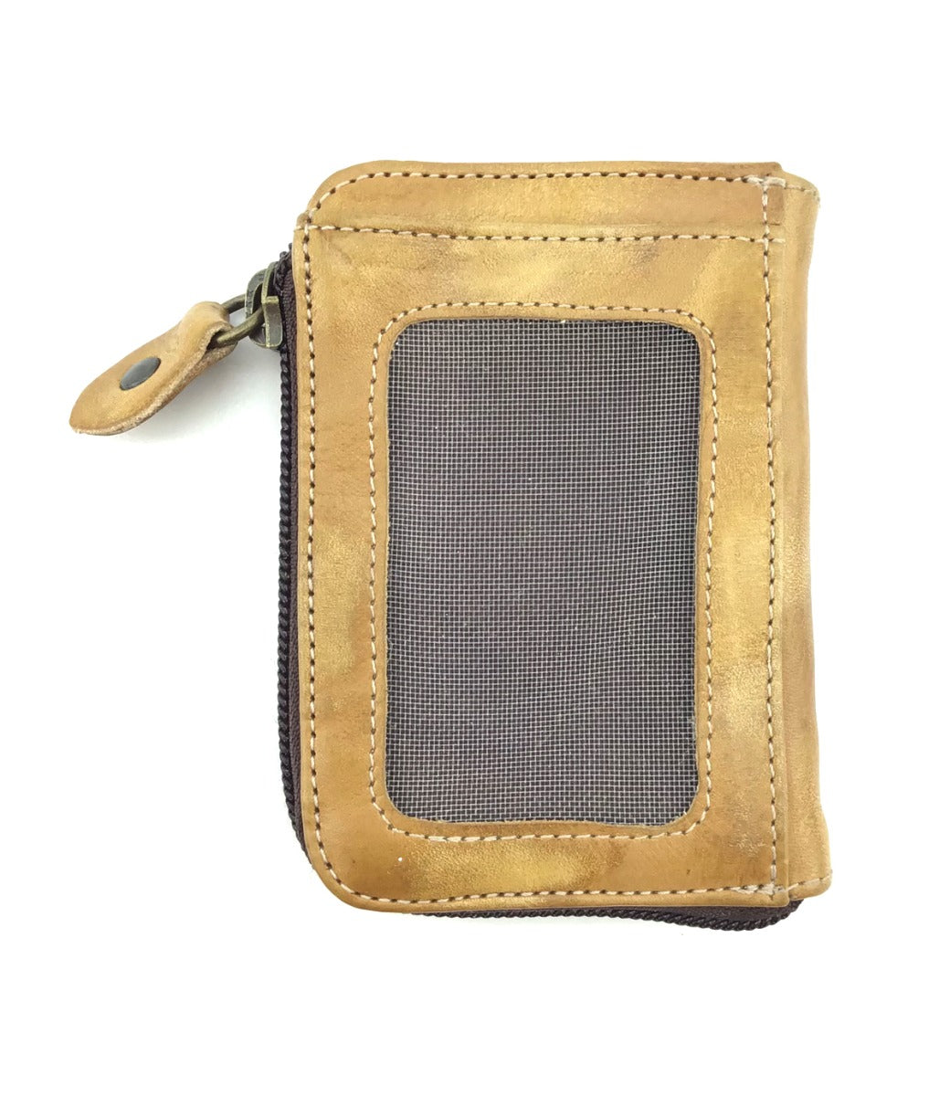 Carrie by Bed|Stü is a compact brown leather wallet, photographed on a white background. It features a convenient zip compartment and a mesh ID window on the front, with handy card slots inside to keep your essentials organized.