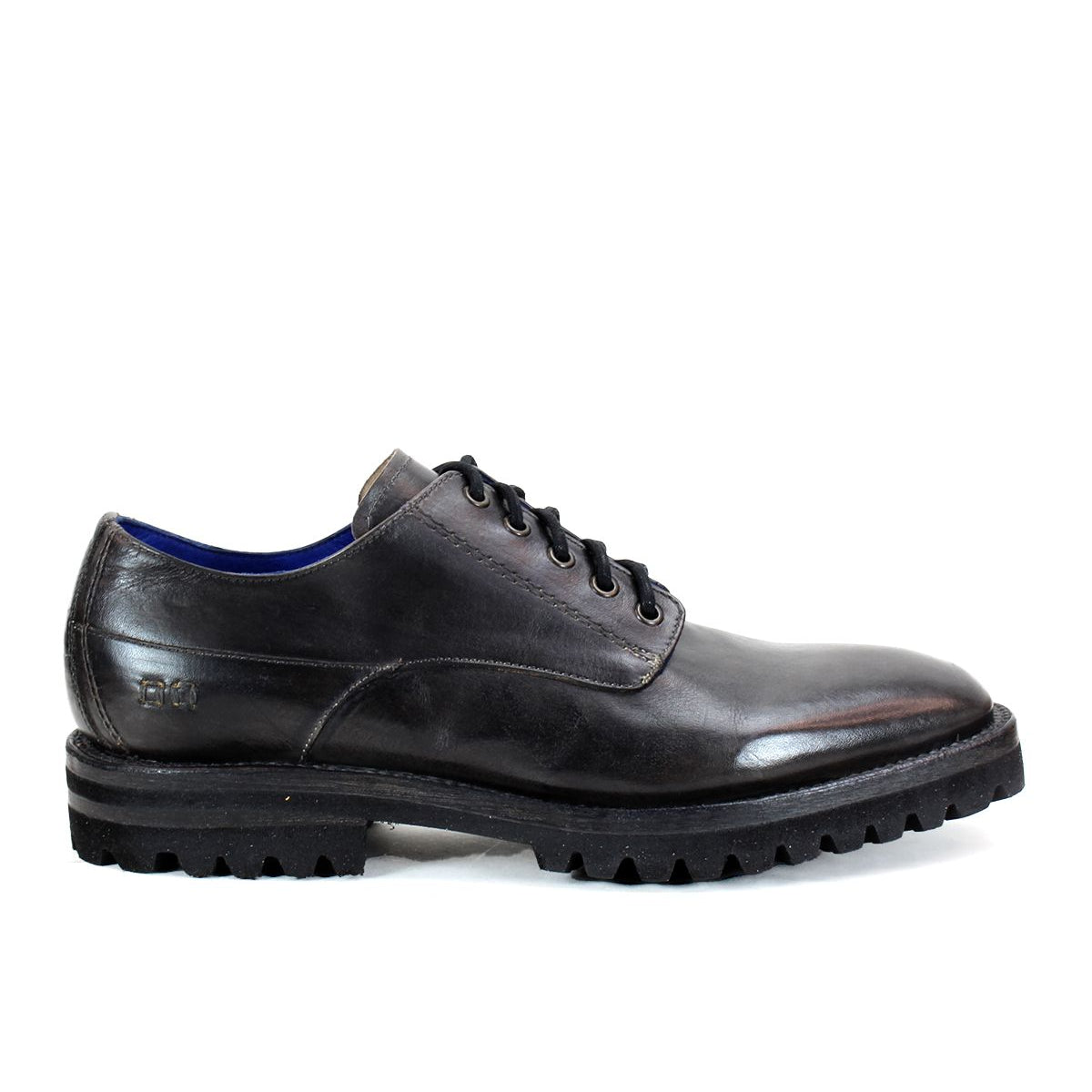 The Bed|Stü Carter is a black leather oxford dress shoe featuring rugged tread and Goodyear welt construction, shown from the side against a plain white background.