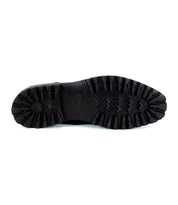 Bottom view of the Carter black oxford dress shoe by Bed|Stü, showcasing a rugged, textured rubber sole with deep treads for traction and Goodyear welt construction for enhanced durability and support.