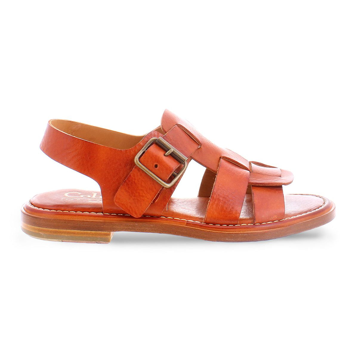 The Charka sandal by Bed|Stü is crafted from vegetable vacchetta brown leather, featuring an open toe, buckle strap, and flat sole, displayed in a side view on a white background.