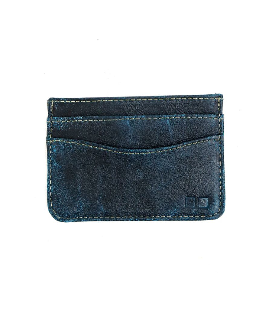 A worn, dark blue leather compact card wallet—Chuck by Bed|Stü—featuring two card slots and visible stitching, displayed on a plain white background.