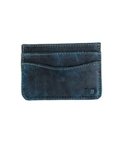 A worn, dark blue leather compact card wallet—Chuck by Bed|Stü—featuring two card slots and visible stitching, displayed on a plain white background.