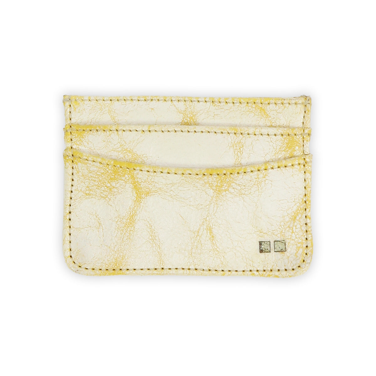 The Bed|Stü Chuck is a cream-colored leather card holder featuring yellow marbling, visible stitching, and two small square metal accents in the bottom right corner—making this compact card wallet perfect for everyday carry.
