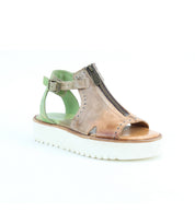The Clancy by Bed|Stü is a tan leather sandal featuring stylish side cutouts, a front zipper, open toe, ankle strap with buckle, and a contrasting white platform sole. Designed with a cushioned insole for added comfort, this sandal is perfect for those seeking fashionable platform shoes. Displayed against a white background.