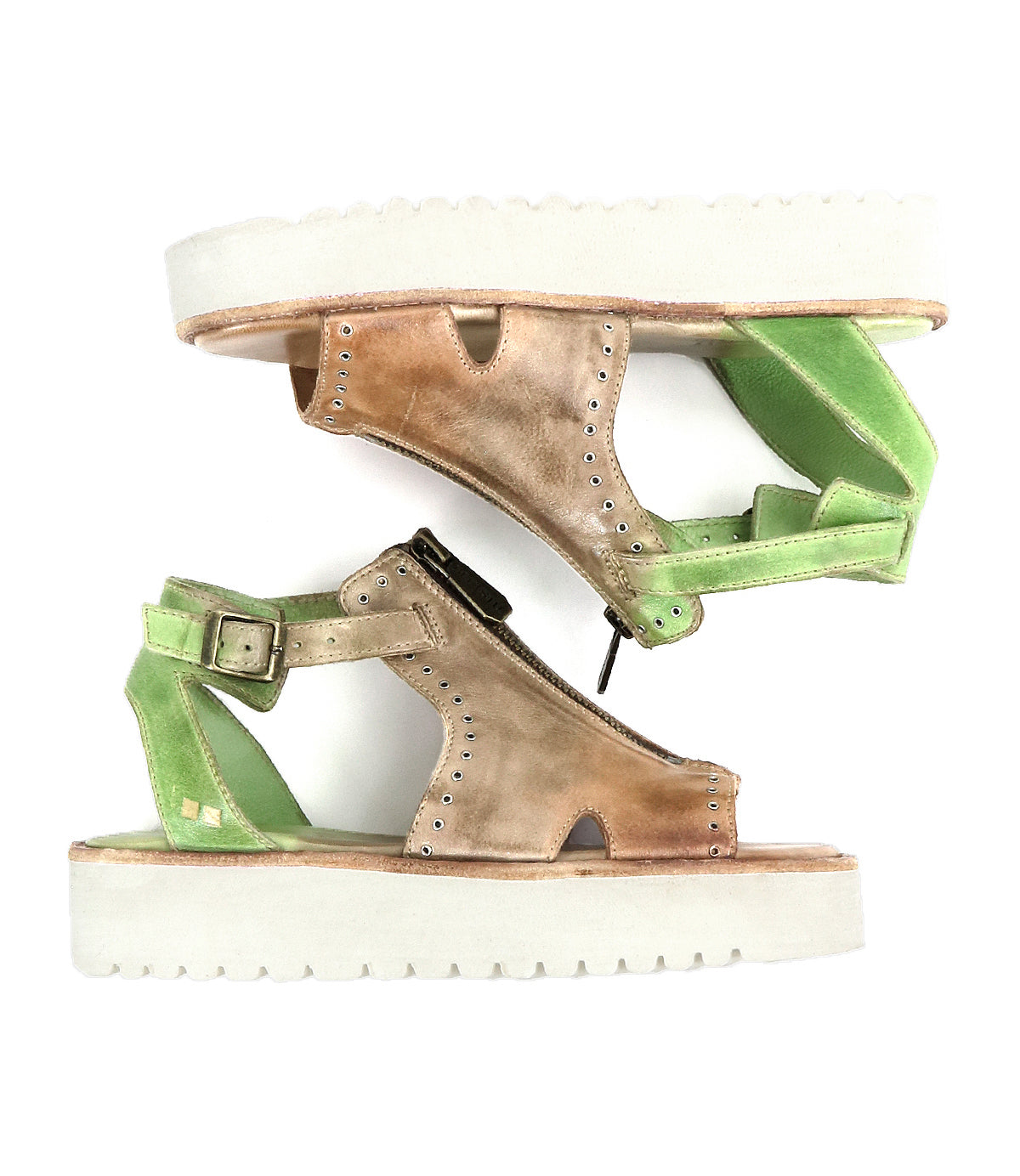 Introducing the Clancy by Bed|Stü: platform sandals featuring white soles, a brown cutout leather front, and green leather back straps arranged in opposite directions, all finished with a cushioned insole for superior comfort.