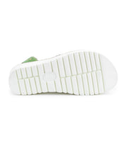 Bottom view of the Bed|Stü Clancy shoe in white, featuring a rubber sole with deep horizontal grooves and a glimpse of the green upper section at the top, designed with a cushioned insole for enhanced comfort.