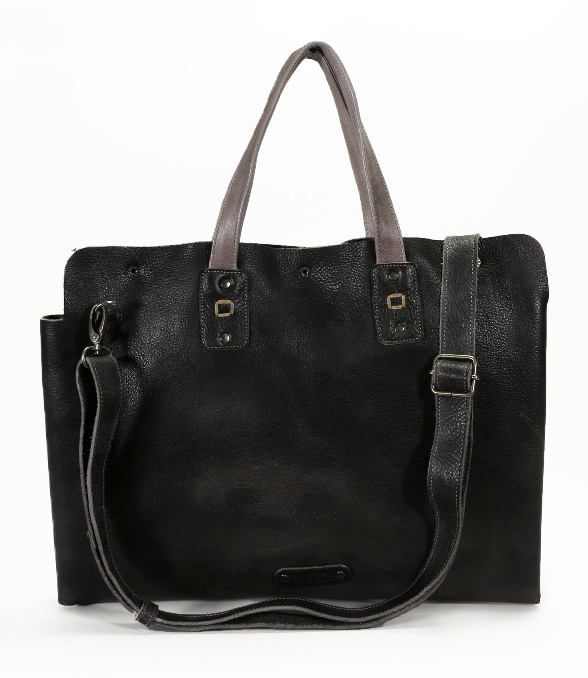 The Bed|Stü Commuter is a black leather bag featuring two short handles, a detachable long strap, and metal buckle accents, shown on a white background—ideal as a stylish mobile office bag for your daily essentials.