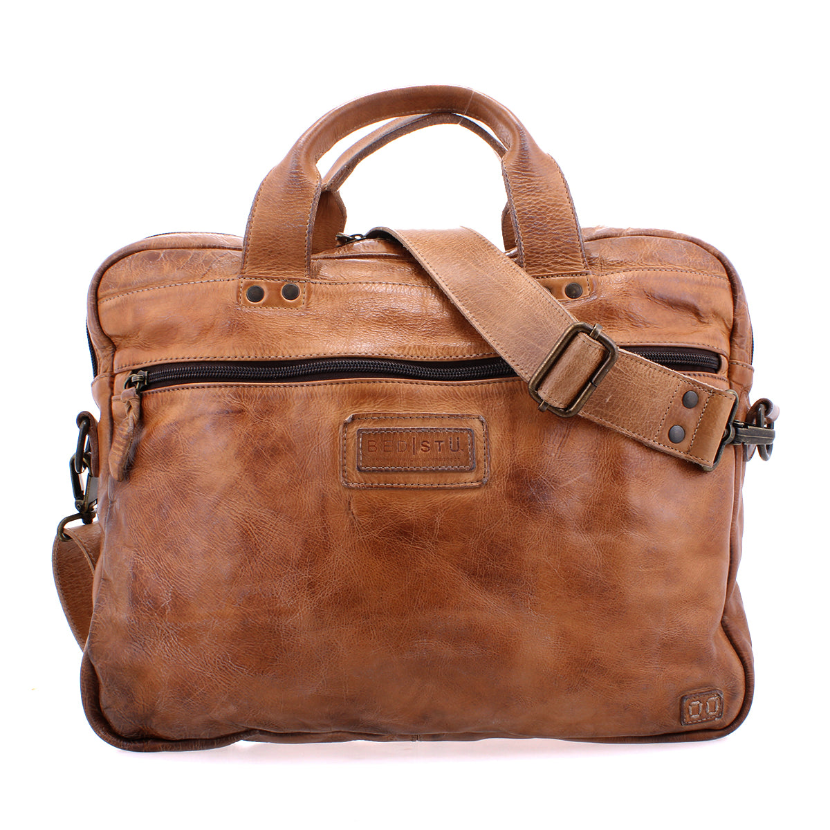 Introducing the Bed|Stü Conclusion: a brown leather messenger bag featuring two short handles, an adjustable shoulder strap, visible front stitching, and a convenient front zipper pocket. Crafted from premium vegetable-tanned leather, the Conclusion also offers a dedicated laptop section for enhanced convenience and organization.