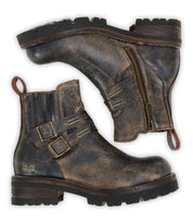 Introducing Daring by Bed|Stü: rugged brown leather ankle boots featuring buckles, side zippers, and distinctive red pull tabs. Shown in both side and sole views, these stacked heel boots are ideal for those seeking sturdy yet stylish footwear.