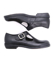 A black Italian shoe with a t-strap and a buckle for women