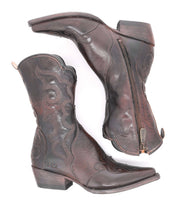 A pair of Deuce Western boots by Bed|Stü, crafted from vegetable-tanned dark brown leather with detailed stitching, low heels, pointed toes, and convenient side zippers, shown on a white background.