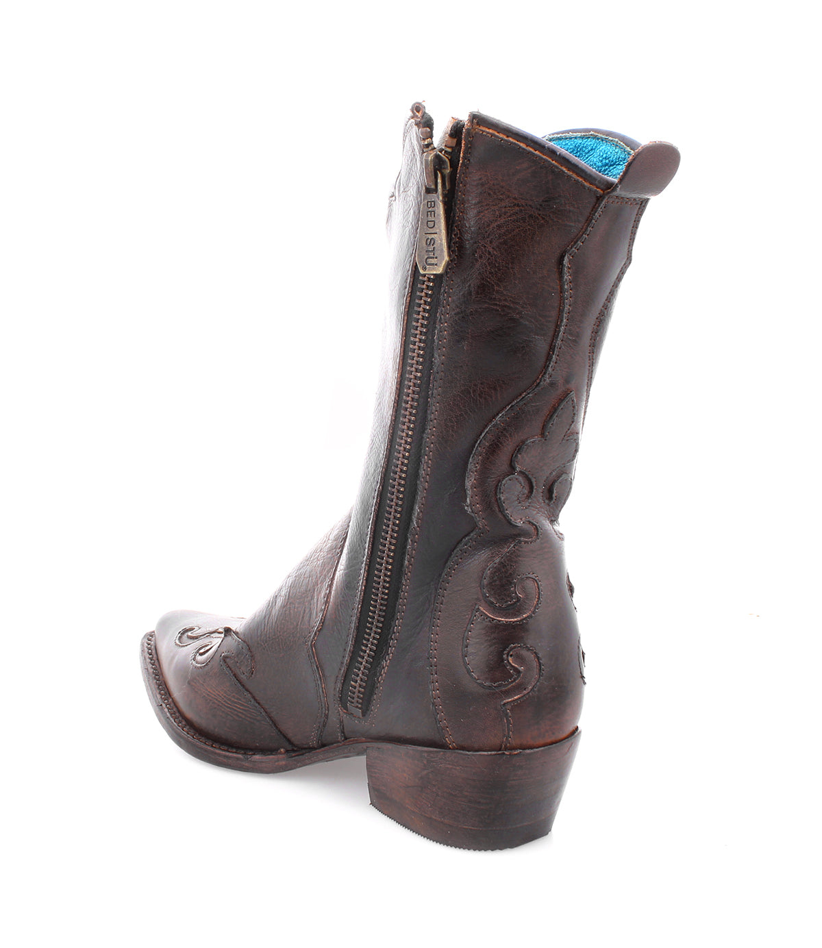 The Bed|Stü Deuce is a brown Western boot crafted from vegetable-tanned leather, featuring detailed stitching, a side zipper, and a low heel, shown on a white background.