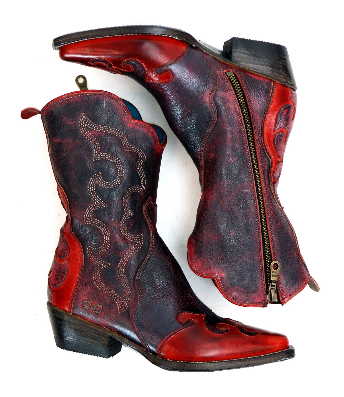 A pair of Deuce short Western boots by Bed|Stü, in dark red and black vegetable-tanned leather with detailed stitching and side zippers, displayed on a white background.