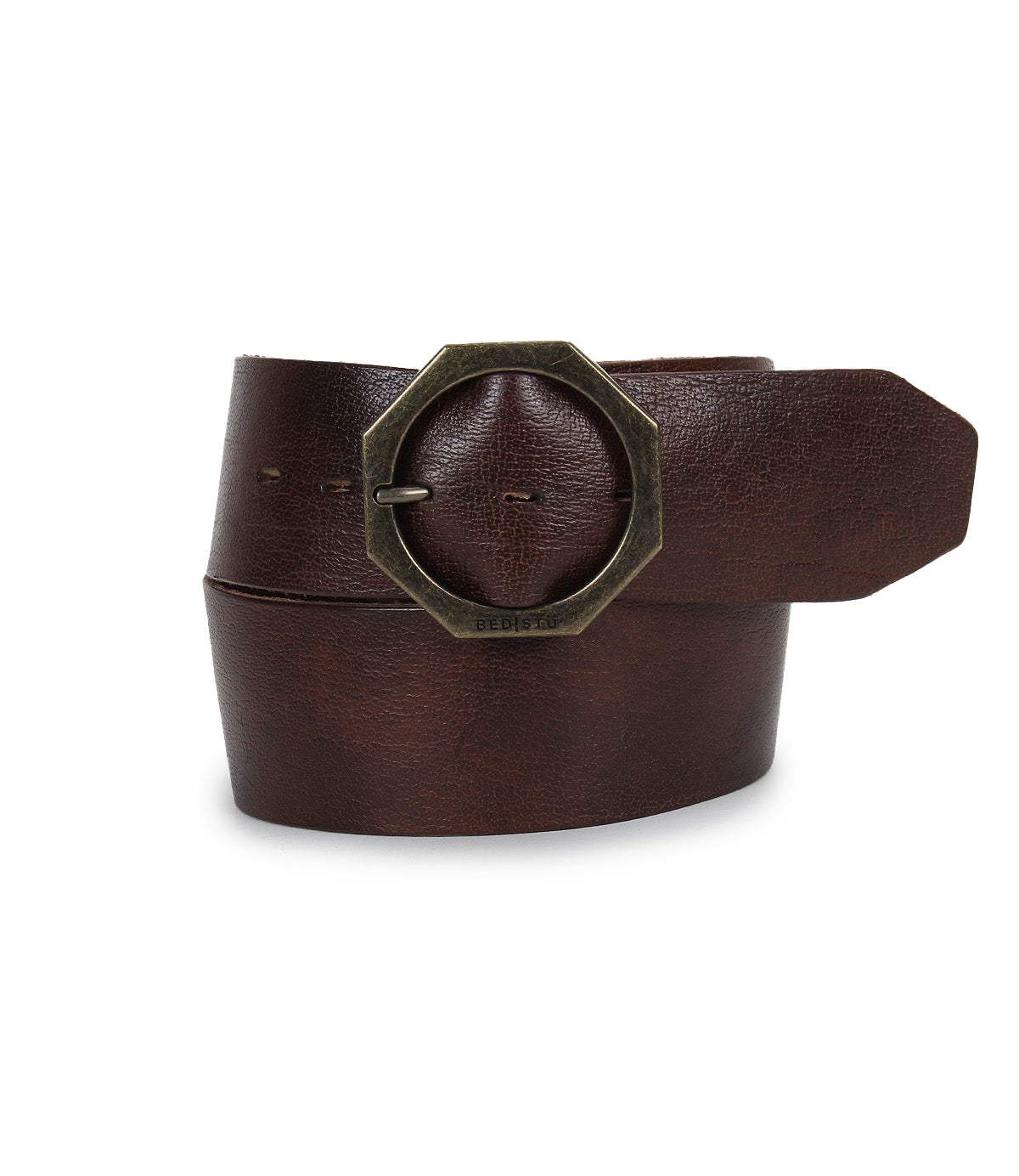 A rolled Bed|Stü Dreampath genuine leather belt with a large, octagon brass-colored metal buckle is displayed against a white background.