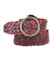 The Dreamweaver belt by Bed|Stü, crafted from woven red and black leather and featuring artisan details with a round silver metal buckle, is coiled on a white background.