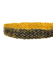 The Bed|Stü Dreamweaver belt, featuring intricately braided yellow and black woven leather, is displayed against a white background to showcase its artisan craftsmanship.