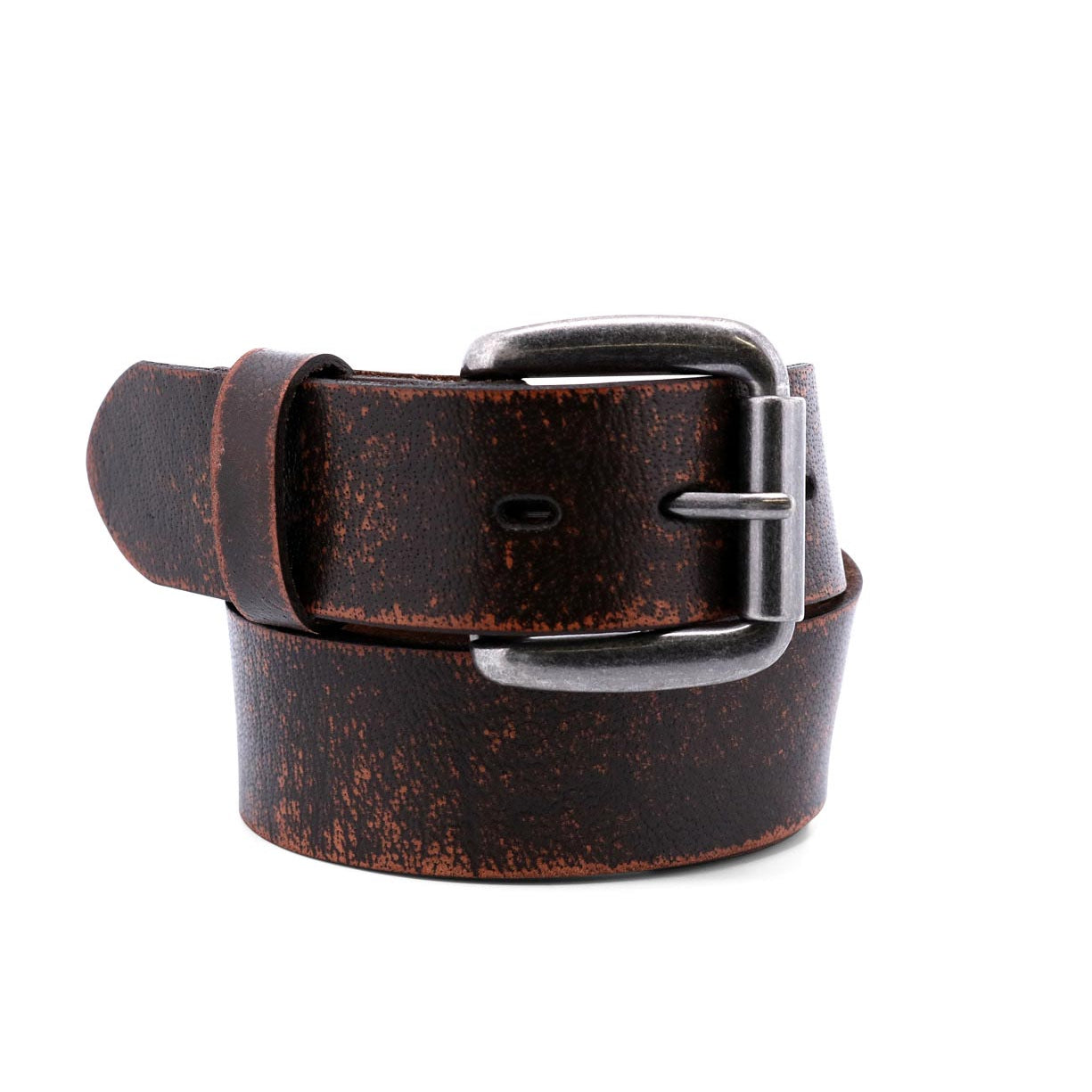 Introducing the Drifter belt by Bed|Stü: a rolled-up, dark brown accessory crafted from textured leather with a distressed finish and complemented by a sleek silver metal buckle, all showcased on a white background for a modern, minimal style.