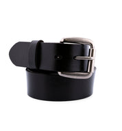 The Bed|Stü Drifter is a black leather belt featuring a textured strap and a silver metal buckle, shown rolled up on a white background in minimalist style.