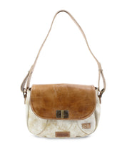 Introducing the Bed|Stü Elect: a two-tone shoulder bag featuring a brown leather flap, beige body, adjustable strap, and a front metal clasp. This piece seamlessly blends vintage charm with everyday practicality—perfect for daily use.