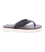 The Elias Light by Bed|Stü is displayed in a side profile view on a plain white background, featuring a black leather flip-flop design with a contrasting white sole and a cushioned footbed for added comfort.