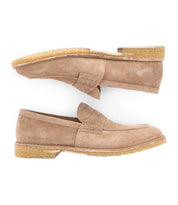 A pair of Bed|Stü Envoy tan suede handcrafted loafers with textured rubber soles, shown in a side view on a white background.