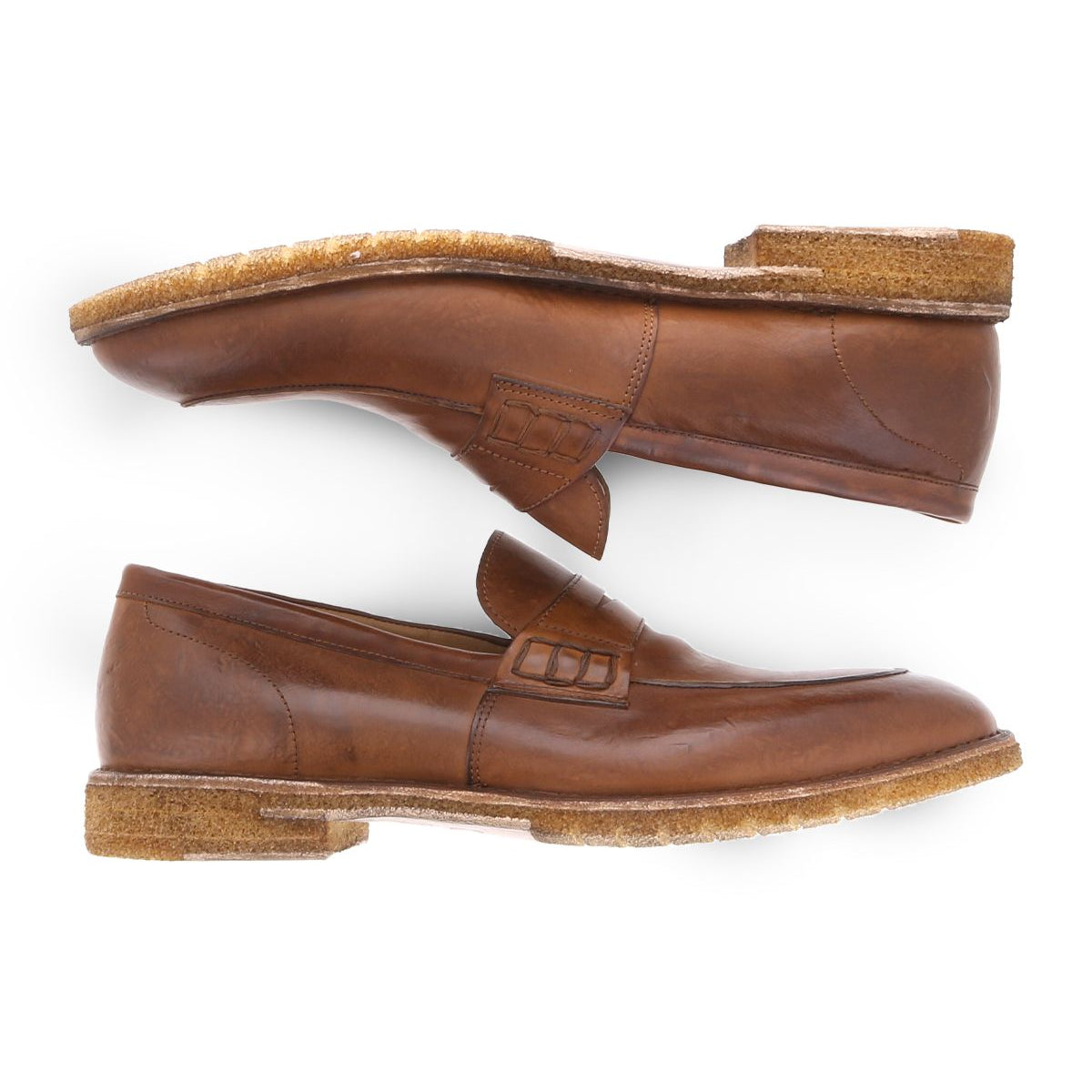 Two Bed|Stü Envoy brown Italian leather loafers are placed side by side, one facing right and the other facing left, against a white background—showcasing the elegance of premium men's footwear.
