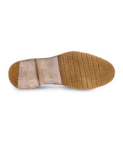 The bottom view of the Bed|Stü Envoy handcrafted loafer displays a textured rubber sole with horizontal grooves and a stitched leather heel section, reflecting the exceptional quality characteristic of premium men's footwear.
