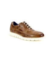 The Bed|Stü Fairman is a brown leather casual men's sneaker featuring a lightweight sole and white laces, photographed on a white background.