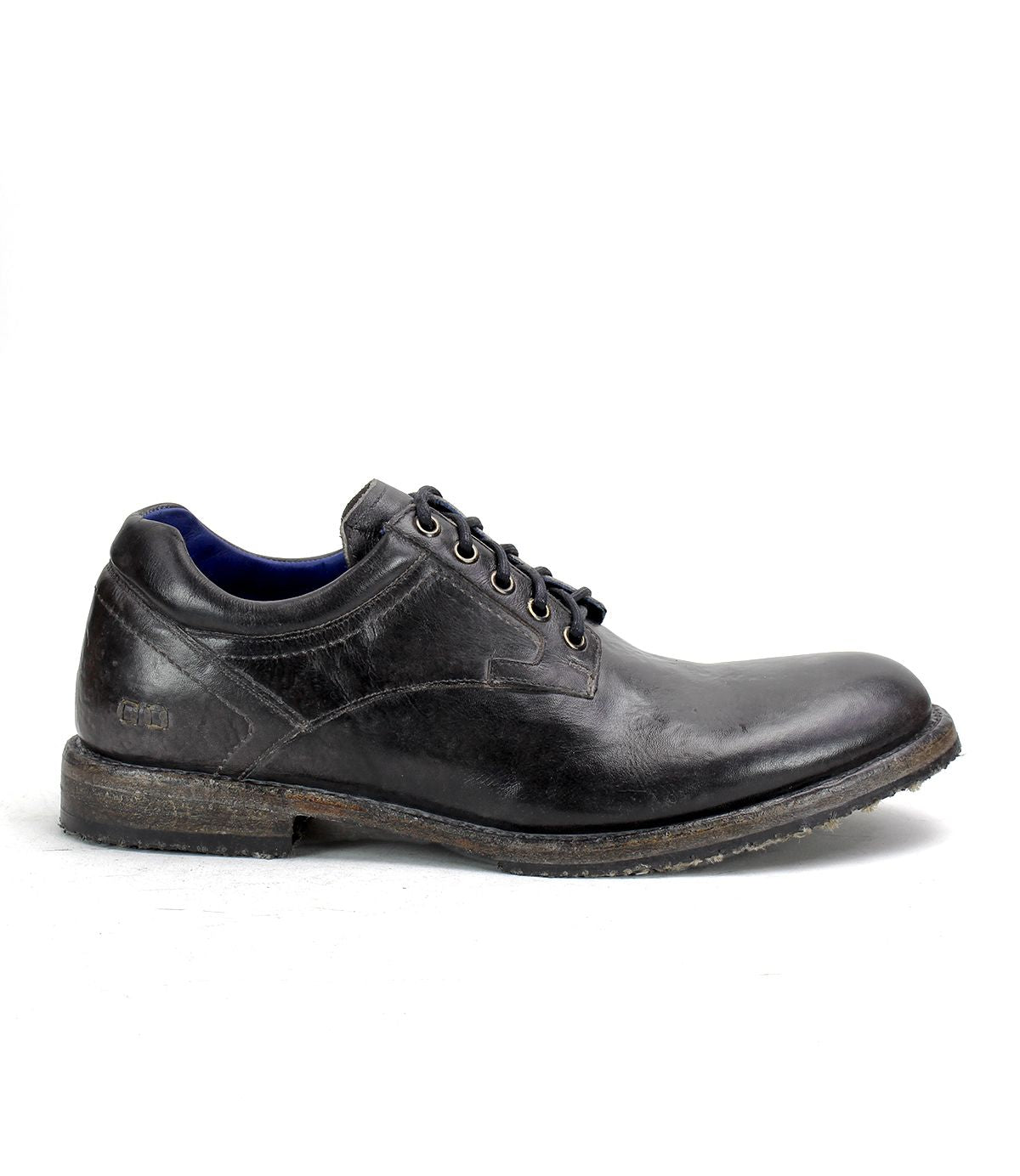 A single Bed|Stü Fierce black washed leather derby lace-up dress shoe with a worn sole, shown in profile on a white background.