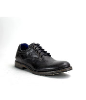 A single Fierce black washed leather derby dress shoe by Bed|Stü, with laces, a slightly worn sole, blue inner lining, and Goodyear welt construction, photographed against a plain white background.