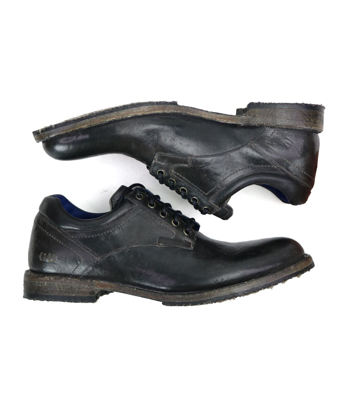 A pair of Bed|Stü Fierce black washed leather derby dress shoes is shown from the side, featuring visible creases and scuff marks on the surface.