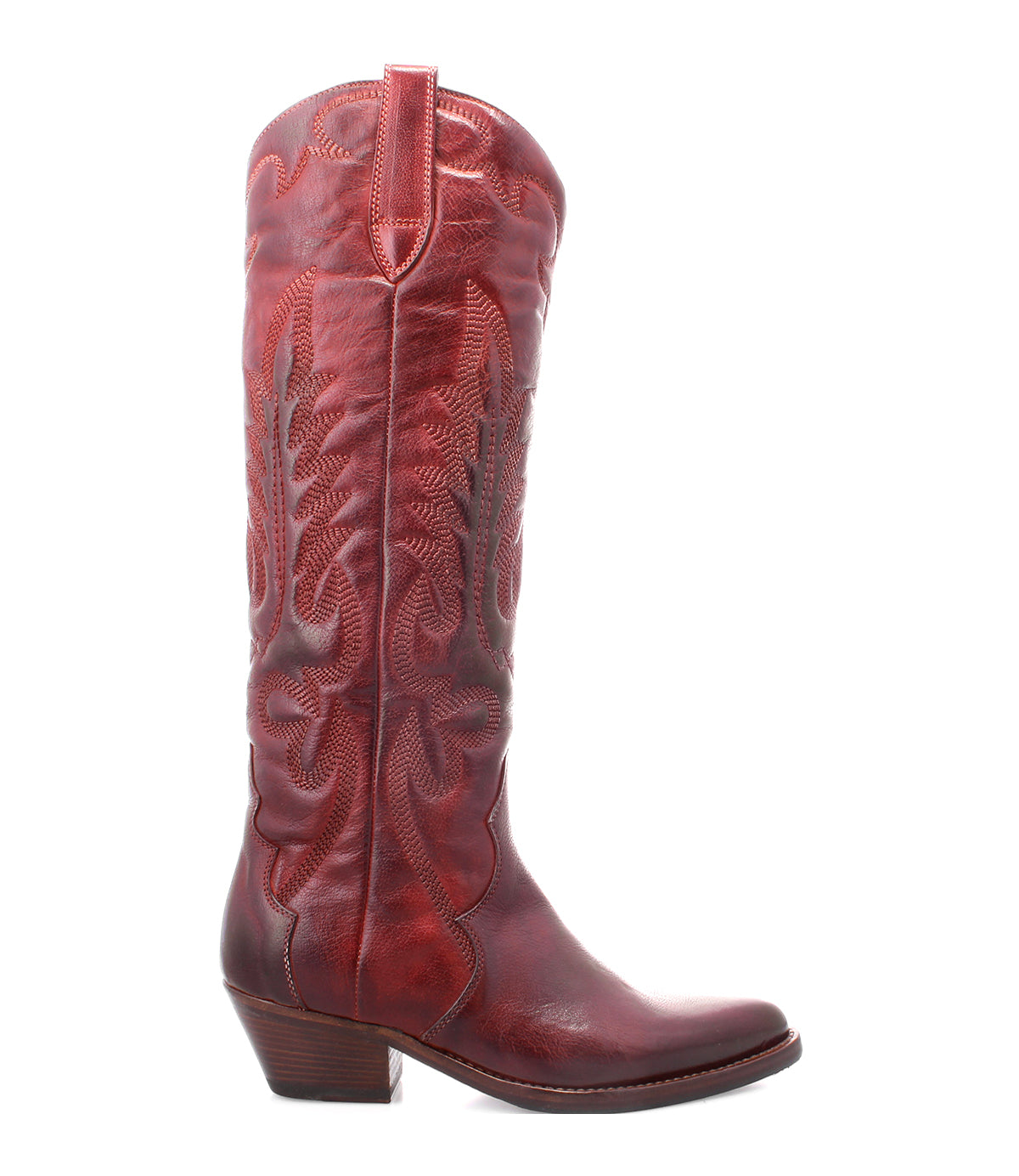 The Bed|Stü Finito is a single tall, red leather cowboy boot with decorative stitching, a pointed toe, and a short angled heel, shown in profile on a white background—capturing classic western style.