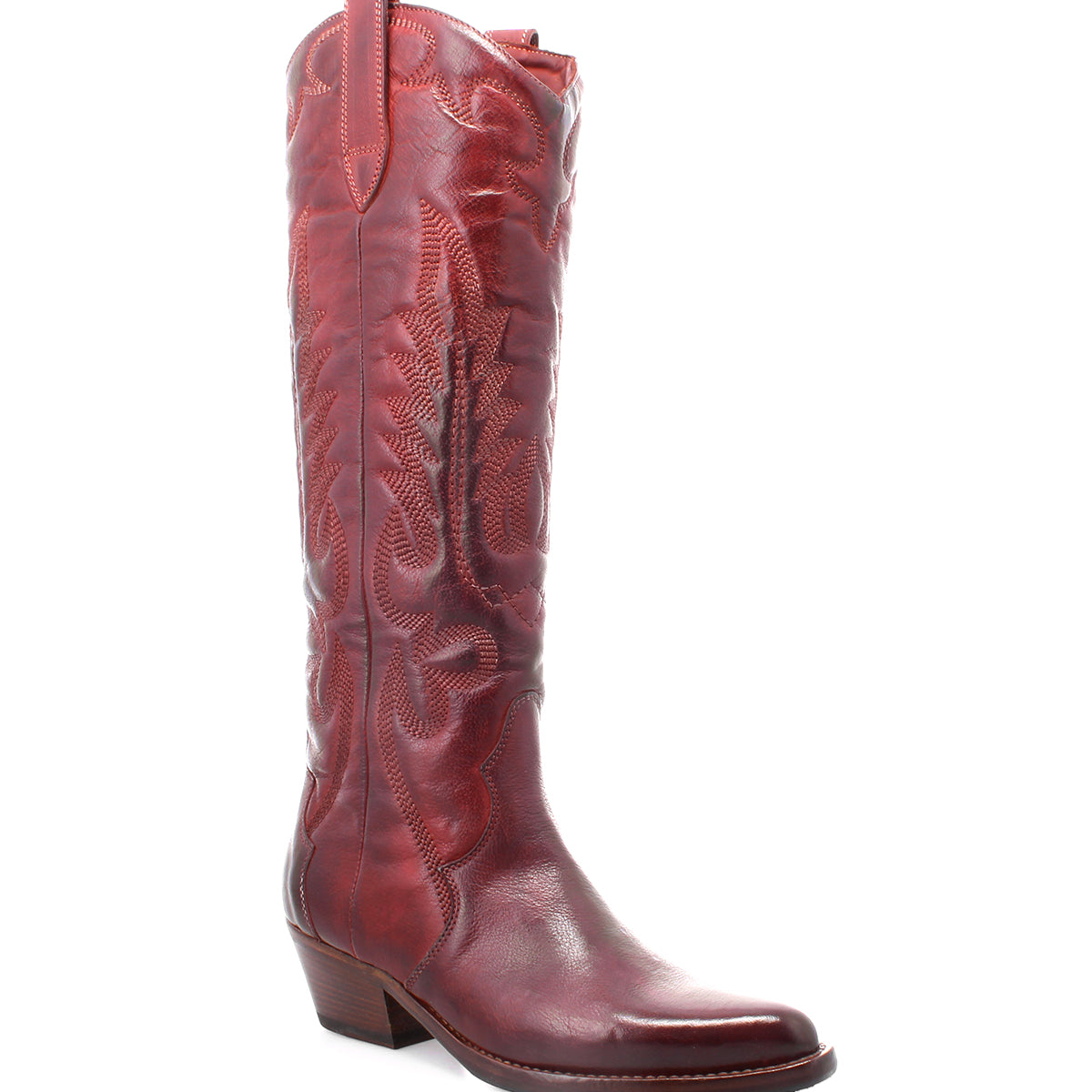 The Bed|Stü Finito is showcased as a single tall, red leather cowboy boot featuring decorative stitching, an angled heel, and a slightly pointed toe. Set against a white background, it highlights the boot’s classic western style and subtle distressed finish.