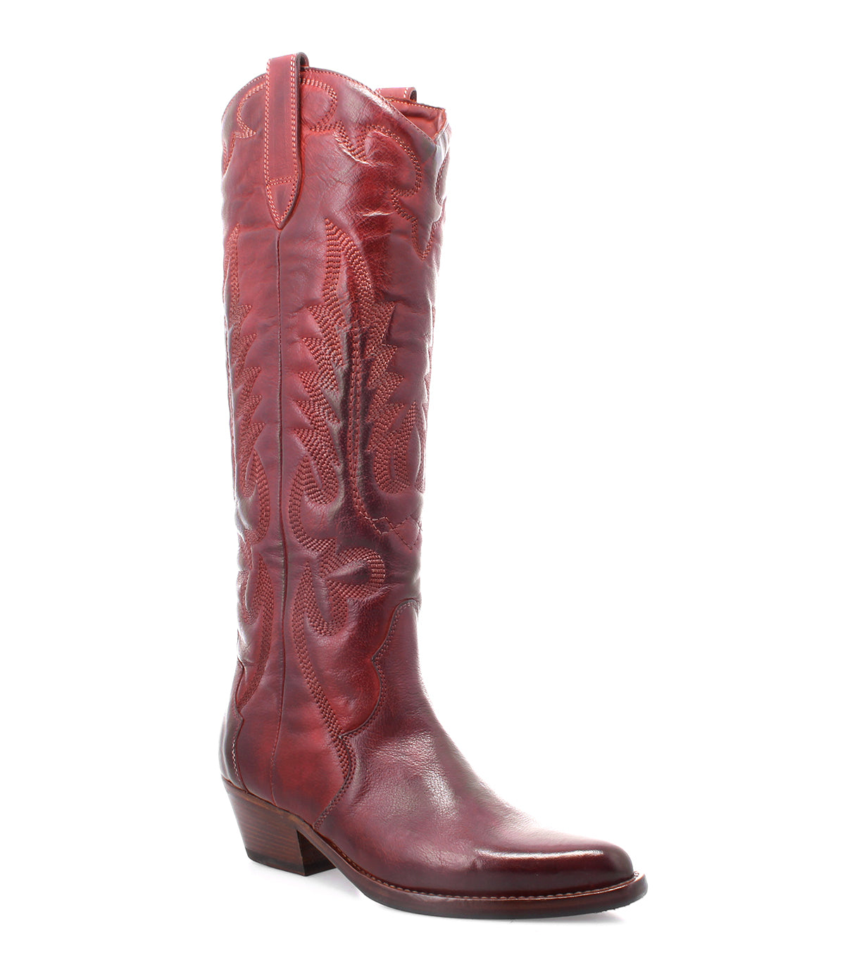 The Bed|Stü Finito is showcased as a single tall, red leather cowboy boot featuring decorative stitching, an angled heel, and a slightly pointed toe. Set against a white background, it highlights the boot’s classic western style and subtle distressed finish.