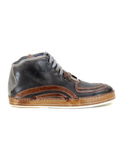 Introducing the Formation sneaker by Bed|Stü, featuring brown and gray leather with classic paneling, laces, a low ankle profile, and a flat light brown sole. Seen from the side against a white background, this design draws inspiration from vintage court sneakers for a blend of timeless style and modern craftsmanship.