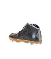 Bed|Stü’s Formation is a single dark brown leather sneaker featuring subtle leather paneling with light brown and gray accents, gray laces, and a tan rubber sole, all positioned on a white background—a modern nod to vintage court sneakers.